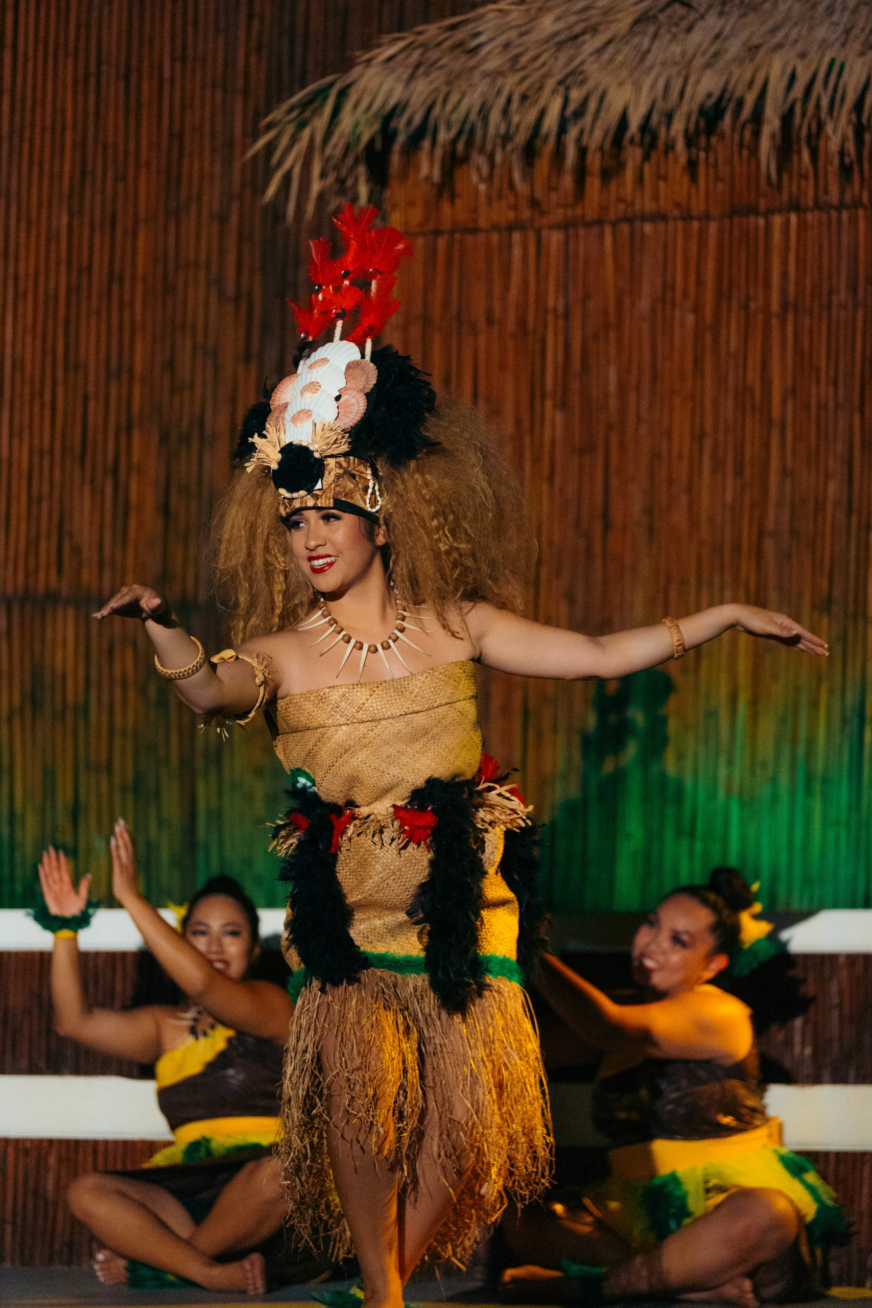 3 luau dancers on stage