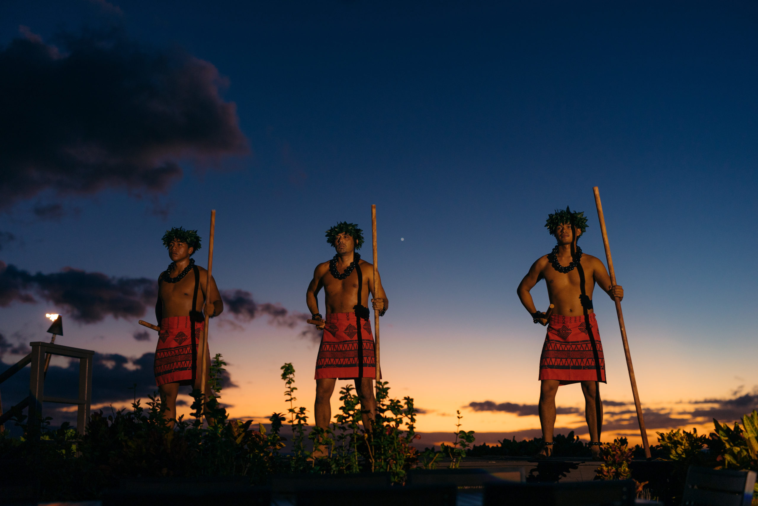 Oceanfront male luau dancers